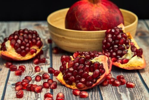 ripe-pomegranate-fruit-on-old-brown-wooden-2026-03-24-10-03-10-utc (1)